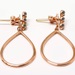 Gems Whisper: 14kt Rose Gold Earrings with Captivating Green Stones