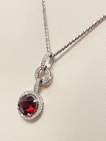  Adjustable Necklace And A 14Kt White Gold Pendant With a Garnet Stone