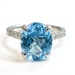 Enchanting Glory: 10Kt White Gold Blue Topaz Ring .25 ctw