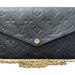 A Staple: Louis Vuitton Empreinte Pochette Felicie Chain Wallet in Black