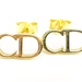  Fusion of Style and Beauty: 18KT Yellow Gold CD Earrings